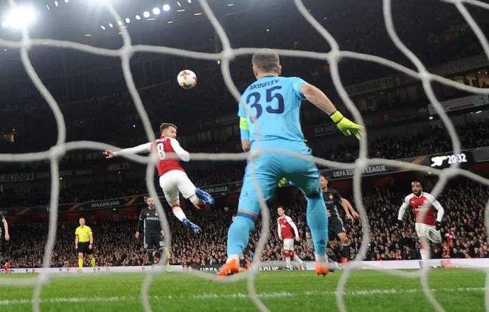 Framed Print : Aaron Ramsey Scores Third Goal Against Igor Akinfeev in Arsenal's Europa League Quarterfinal vs CSKA Moscow Framed Print : Aaron Ramsey Scores Third Goal Against Igor Akinfeev in Arsenal's Europa League Quarterfinal vs CSKA Moscow