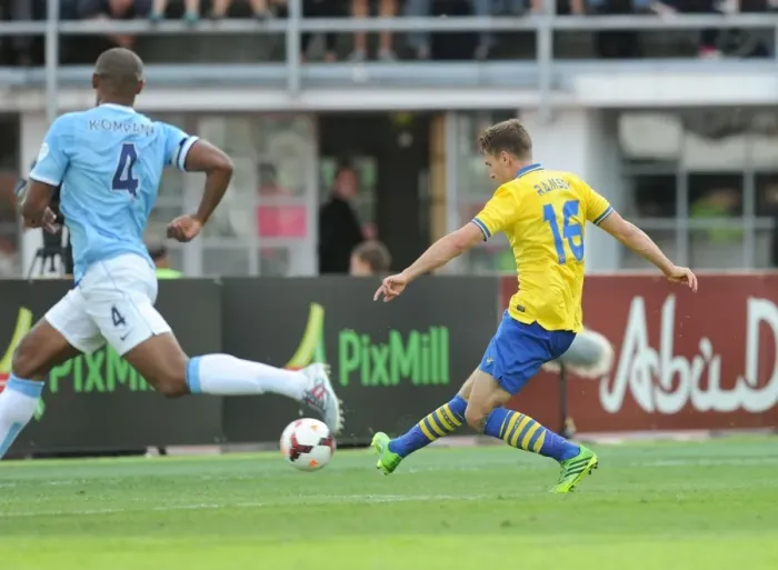 Framed Print : Aaron Ramsey Scores Past Vincent Kompany: Arsenal vs. Manchester City Pre-Season Clash, Finland 2013