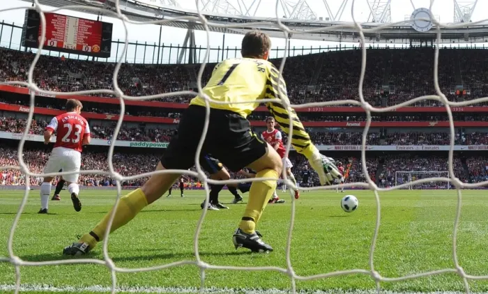 Framed Print : Aaron Ramsey shoots past Man United goalkeeper Edwin van der Sar to score the Arsenal goal Framed Print : Aaron Ramsey shoots past Man United goalkeeper Edwin van der Sar to score the Arsenal goal