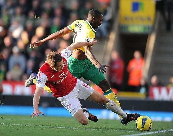 Aaron Ramsey Tackles Leon Barnett: Intense Moment from Norwich City vs. Arsenal (2011-12)