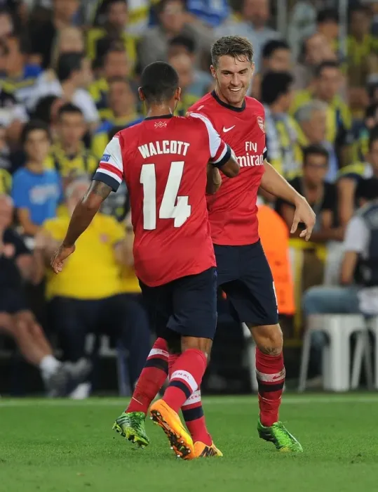 Framed Print : Aaron Ramsey and Theo Walcott Celebrate Goals: Arsenal's Dominance over Fenerbahce in 2013-14 UEFA Champions League Play-offs