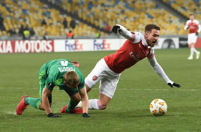 Framed Print : Aaron Ramsey Tripped by Igor Parduta: Penalty Drama in Arsenal's UEFA Europa League Clash with Vorskla Poltava Framed Print : Aaron Ramsey Tripped by Igor Parduta: Penalty Drama in Arsenal's UEFA Europa League Clash with Vorskla Poltava