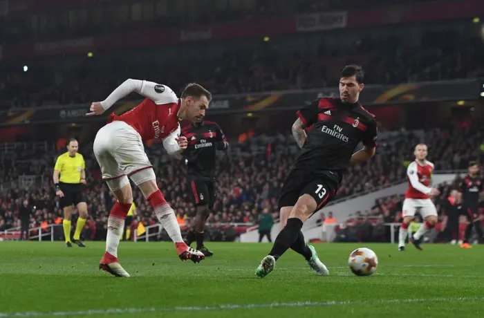 Framed Print : Aaron Ramsey vs Alessio Romagnoli: Tense Moment at the Emirates - Arsenal vs AC Milan, UEFA Europa League 2018 Framed Print : Aaron Ramsey vs Alessio Romagnoli: Tense Moment at the Emirates - Arsenal vs AC Milan, UEFA Europa League 2018