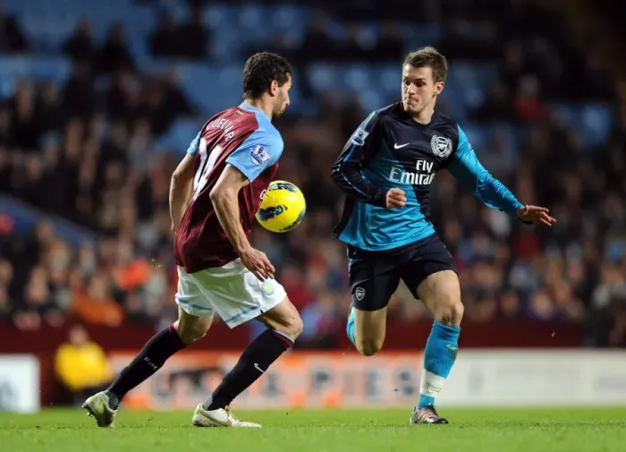 Framed Print : Aaron Ramsey vs. Carlos Cuellar: Battle in the Midfield - Aston Villa vs. Arsenal (2011-12) Framed Print : Aaron Ramsey vs. Carlos Cuellar: Battle in the Midfield - Aston Villa vs. Arsenal (2011-12)