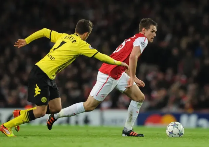 Framed Print : Aaron Ramsey vs. Felipe Santana: Clash at the Emirates - Arsenal v Borussia Dortmund, UEFA Champions League, 2011