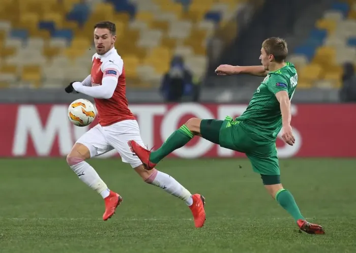 Framed Print : Aaron Ramsey vs. Igor Perduta: Clash in the Europa League between Arsenal and Vorskla Poltava