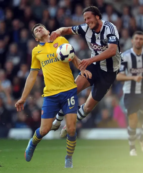 Framed Print : Aaron Ramsey vs. Jonas Olsson: Clash at The Hawthorns - West Bromwich Albion vs. Arsenal (2013-14)