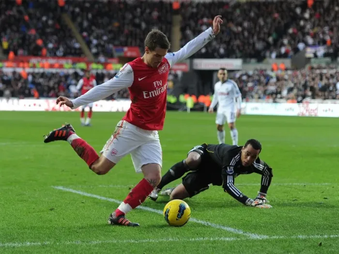 Framed Print : Aaron Ramsey vs. Michel Vorm: Battle at the Swansea Goal
