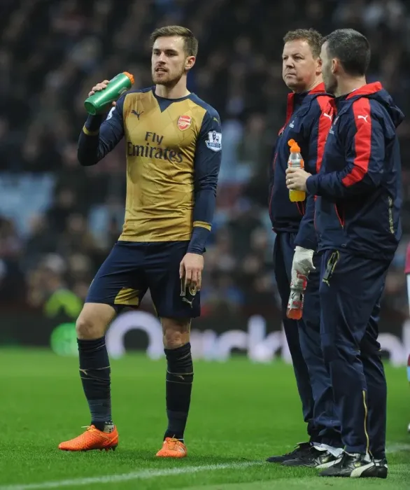 Framed Print : Aaron Ramsey's Heart-to-Heart with Arsenal Physio Colin Lewin (2015-16)
