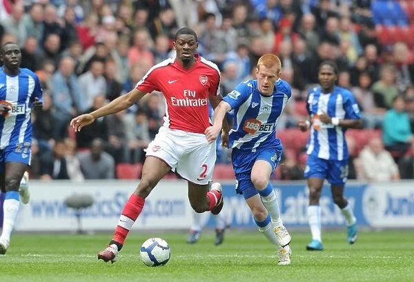 Abou Diaby (Arsenal) Ben Watson (Wigan). Wigan Athletic 3: 2 Arsenal, FA Barclays Premier League