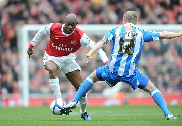 Abou Diaby (Arsenal) Tom Clarke (Huddersfield). Arsenal 2:1 Huddersfield Town