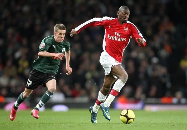 Abou Diaby and Craig Noone Clash in FA Cup: Arsenal's 3:1 Victory over Plymouth Argyle at Emirates Stadium (January 3, 2009)