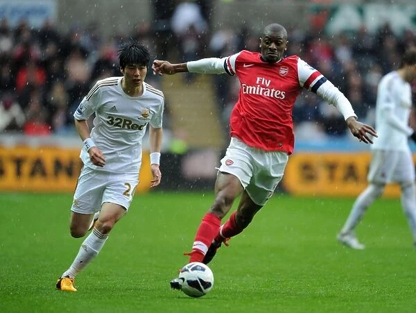 Abou Diaby Outmaneuvers Ki Sung-Yueng: Premier League Battle at Swansea City, 2012-13