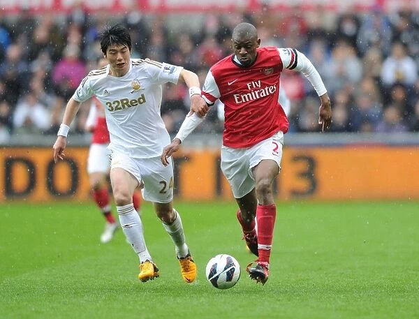 Abou Diaby Outmaneuvers Ki Sung-Yueng: A Premier League Battle at Swansea City, 2012-13
