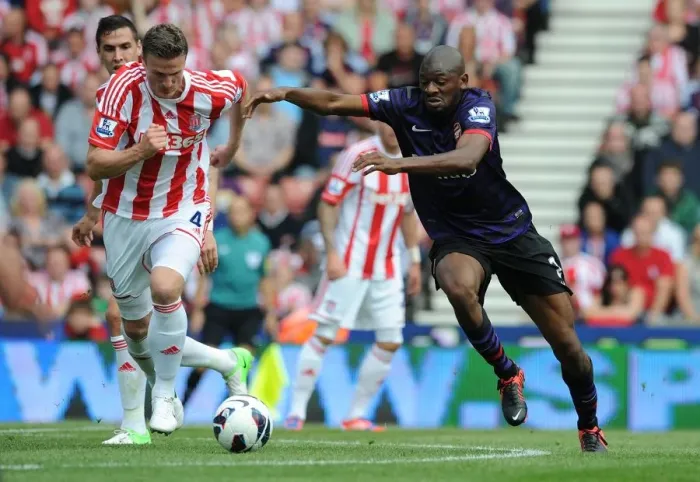 Framed Print : Abou Diaby Outmaneuvers Robert Huth: A Battle in the Premier League Match Between Stoke City and Arsenal (2012-13) Framed Print : Abou Diaby Outmaneuvers Robert Huth: A Battle in the Premier League Match Between Stoke City and Arsenal (2012-13)