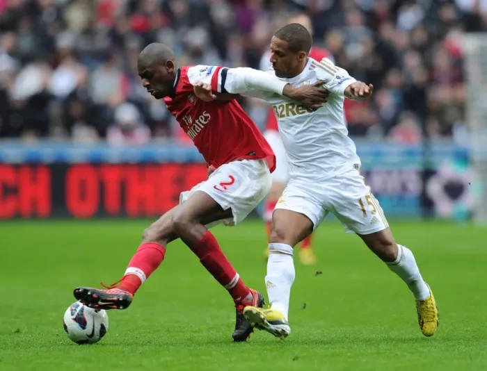 Framed Print : Abou Diaby vs Ashley Williams: Intense Battle at Swansea City vs Arsenal (2012-13)