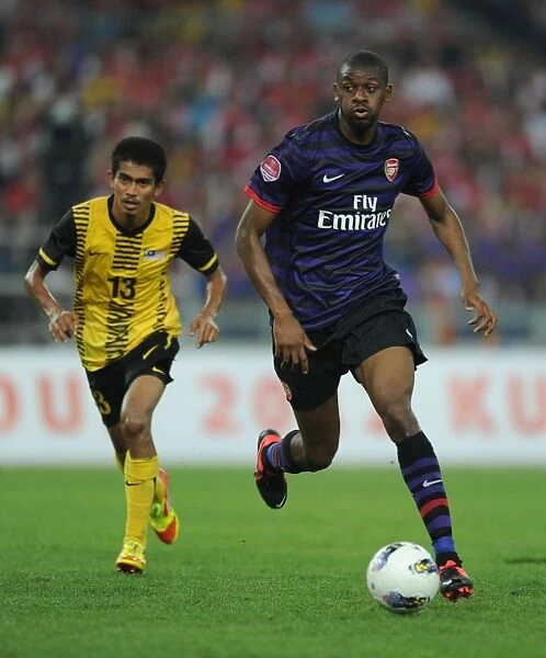 Abou Diaby vs Azamuddin Akil: Clash in the 2012-13 Pre-Season Friendly between Malaysia XI and Arsenal