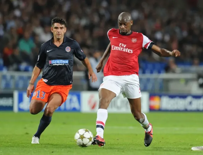 Framed Print : Abou Diaby vs. Marco Estrada: A Battle in the UEFA Champions League - Arsenal's Diaby Outmaneuvers Montpellier's Defender Framed Print : Abou Diaby vs. Marco Estrada: A Battle in the UEFA Champions League - Arsenal's Diaby Outmaneuvers Montpellier's Defender