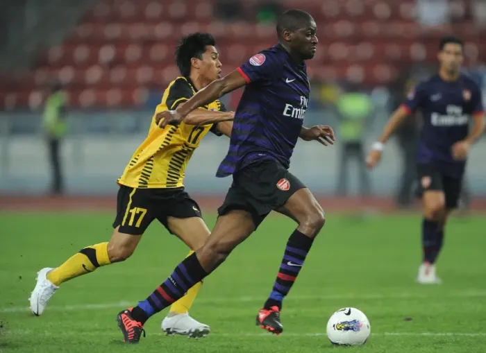 Framed Print : Abou Diaby vs Mohd Shakir Shaari: Clash in Kuala Lumpur - Arsenal FC vs Malaysia XI (2012) Framed Print : Abou Diaby vs Mohd Shakir Shaari: Clash in Kuala Lumpur - Arsenal FC vs Malaysia XI (2012)