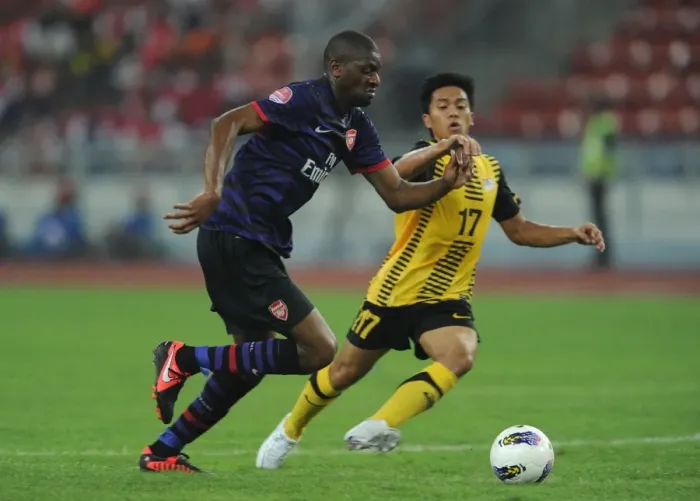 Framed Print : Abou Diaby vs Mohd Shakir Shaari: Clash of the Stars in Arsenal's 2012 Pre-Season Match against Malaysia XI Framed Print : Abou Diaby vs Mohd Shakir Shaari: Clash of the Stars in Arsenal's 2012 Pre-Season Match against Malaysia XI