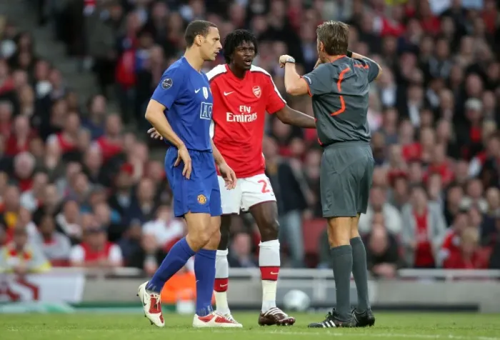 Framed Print : Adebayor and Ferdinand's Contentious Chat: Arsenal vs. Manchester United in the UEFA Champions League Semi-Final Framed Print : Adebayor and Ferdinand's Contentious Chat: Arsenal vs. Manchester United in the UEFA Champions League Semi-Final