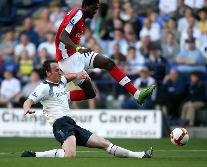 Framed Print : Adebayor Leaps Over O'Brien: Arsenal vs. Bolton Wanderers, Barclays Premier League (2008-2009)