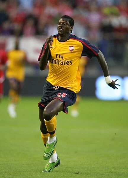 Adebayor's Brilliance: Arsenal's 2-0 Champions League Triumph Over FC Twente