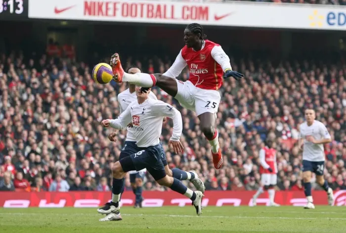 Framed Print : Adebayor's Double Strike: Arsenal Edge Past Tottenham 2-1 in Premier League Rivalry