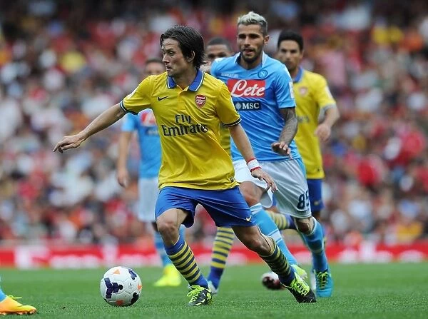 Agile Rosicky Outmaneuvers Behrami: Arsenal Star's Impressive Run at 2013 Emirates Cup