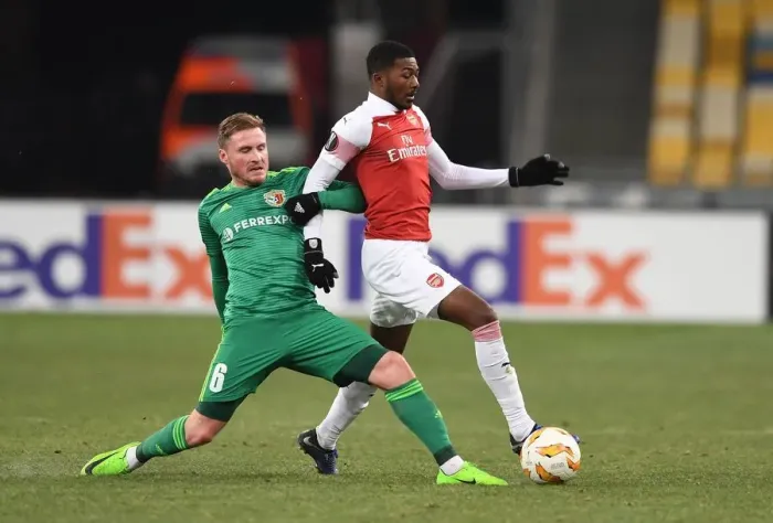 Framed Print : Ainsley Maitland-Niles vs. Oleksandr Skliar: A Battle in the Europa League Clash between Arsenal and Vorskla Poltava