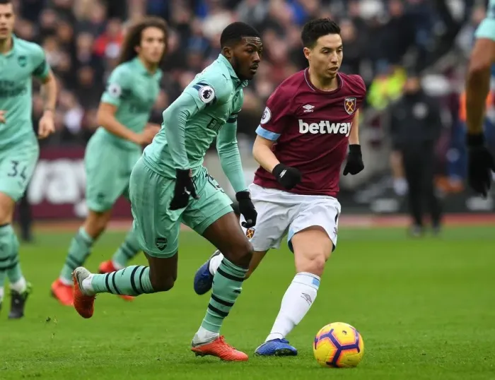 Framed Print : Ainsley Maitland-Niles vs Samir Nasri: Battle in the Premier League between West Ham and Arsenal