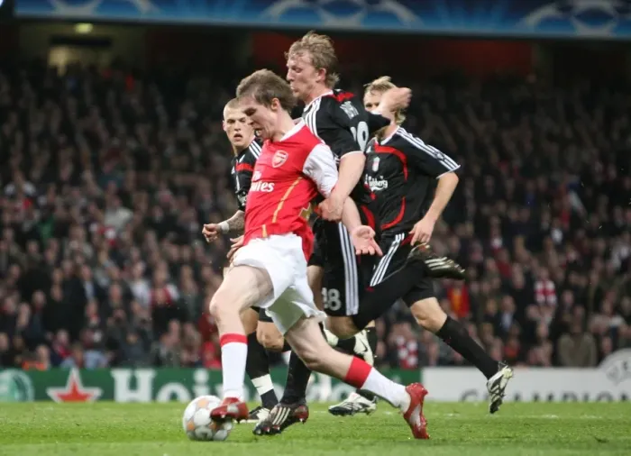 Framed Print : Alex Hleb (Arsenal) is fouled by Dirk Kuyt but a penalty isn t given