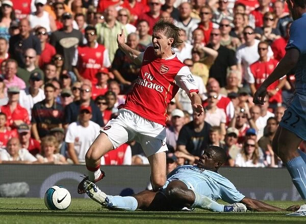 Alex Hleb (Arsenal) is fouled by Micah Richards (Man City) for the Arsenal penalty