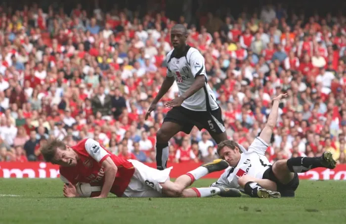 Framed Print : Alex Hleb is brought down for a penalty by Fulham defender Moritz Volz