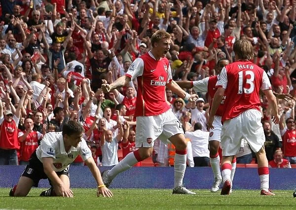 Alex Hleb celebrates scoring the 2nd Arsenal goal with Nicklas Bendtner