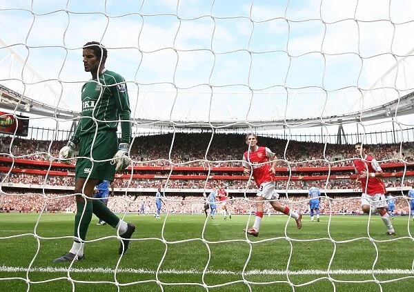 Alex Hleb and Cesc Fabregas celebrate the 1st Arsenal goal scored by Emmanuel Adebayor