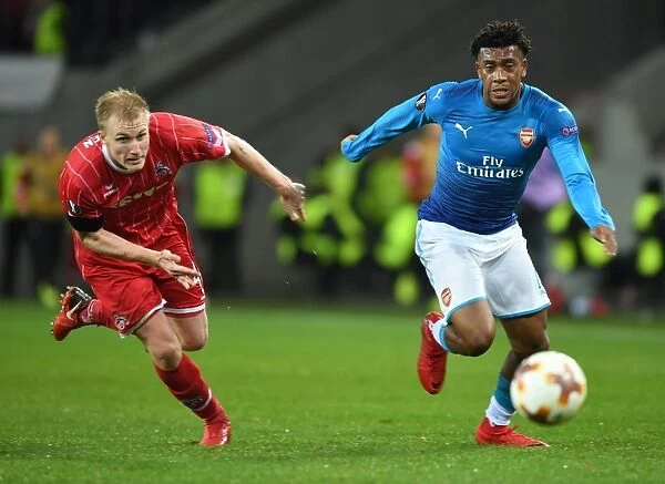 Alex Iwobi Breaks Past Frederik Sorensen: Arsenal's Thrilling Moment against 1. FC Koln in Europa League