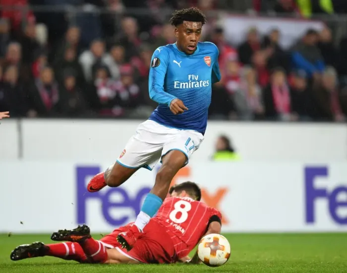 Framed Print : Alex Iwobi Outmaneuvers Milos Jojic in Arsenal's UEFA Europa League Clash against 1. FC Koln