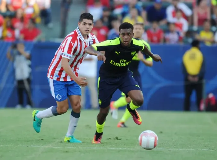 Framed Print : Alex Iwobi Outsmarts Orbelin Pineda: Arsenal Star's Agile Move in Pre-Season Clash Against Chivas Framed Print : Alex Iwobi Outsmarts Orbelin Pineda: Arsenal Star's Agile Move in Pre-Season Clash Against Chivas
