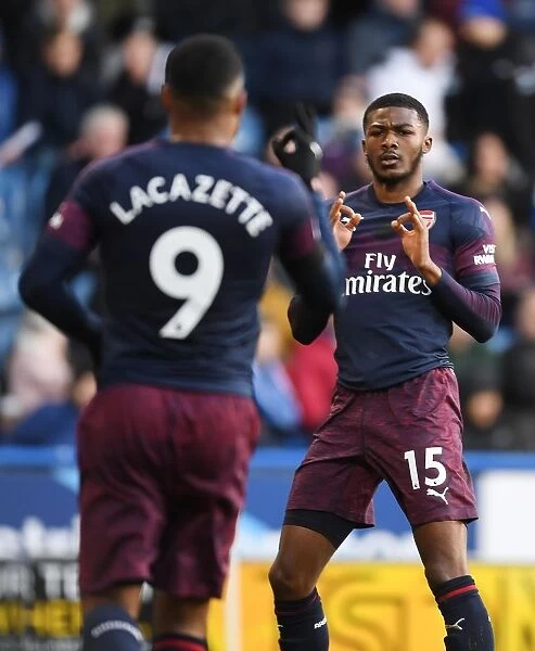 Alex Lacazette and Ainsley Maitland-Niles Celebrate Arsenal's Second Goal vs. Huddersfield Town