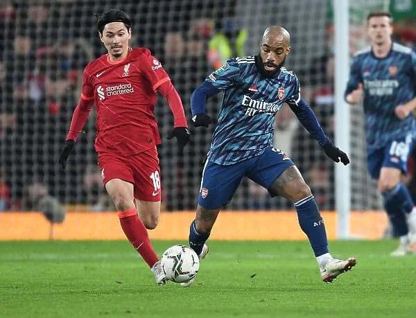 Alex Lacazette Outsmarts Minamino: A Crucial Moment in the Carabao Cup Semi-Final Battle Between Liverpool and Arsenal