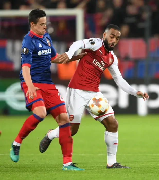 Framed Print : Alex Lacazette vs. Vasili Berezutski: A Battle in the UEFA Europa League Quarterfinals