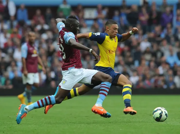 Framed Print : Alex Oxlade-Chamberlain Outmaneuvers Aly Cissokho in Aston Villa vs Arsenal Premier League Clash Framed Print : Alex Oxlade-Chamberlain Outmaneuvers Aly Cissokho in Aston Villa vs Arsenal Premier League Clash
