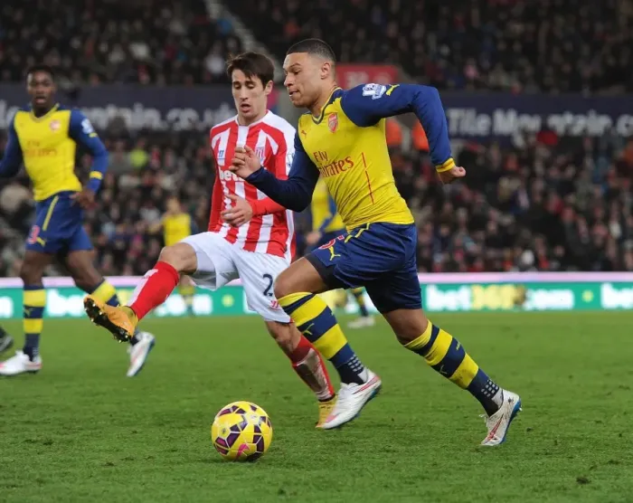 Framed Print : Alex Oxlade-Chamberlain Outmaneuvers Bojan: A Moment from Stoke City vs. Arsenal (2014-15)