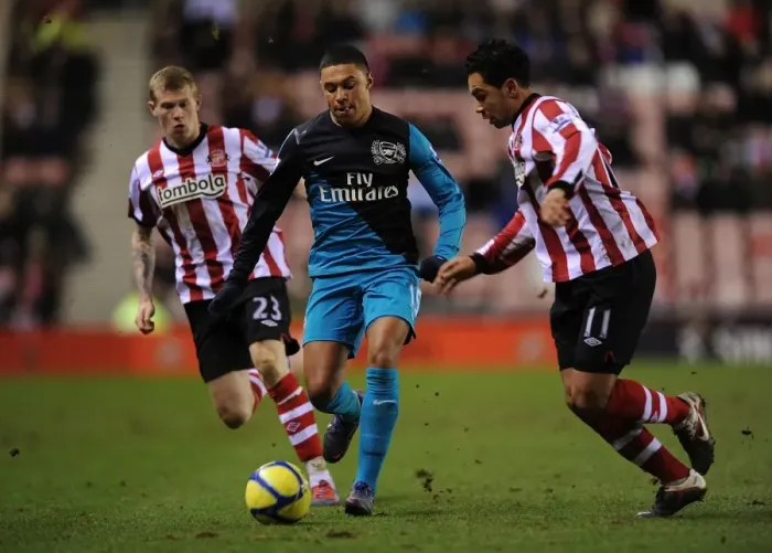 Framed Print : Alex Oxlade-Chamberlain Outmaneuvers Kieran Richardson in FA Cup Fifth Round Clash Framed Print : Alex Oxlade-Chamberlain Outmaneuvers Kieran Richardson in FA Cup Fifth Round Clash