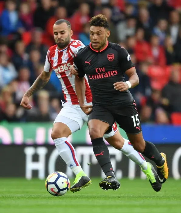 Framed Print : Alex Oxlade-Chamberlain Outsmarts Jese: A Premier League Battle at Stoke City, 2017-18 Framed Print : Alex Oxlade-Chamberlain Outsmarts Jese: A Premier League Battle at Stoke City, 2017-18