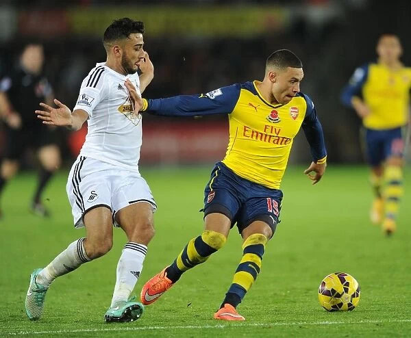 Alex Oxlade-Chamberlain Stands Firm Against Neil Taylor's Challenge (Swansea vs Arsenal, 2014-15)