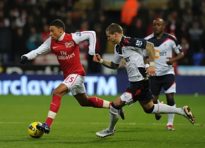 Framed Print : Alex Oxlade-Chamberlain Surges Past Gretar Steinsson in Bolton vs Arsenal Premier League Clash Framed Print : Alex Oxlade-Chamberlain Surges Past Gretar Steinsson in Bolton vs Arsenal Premier League Clash
