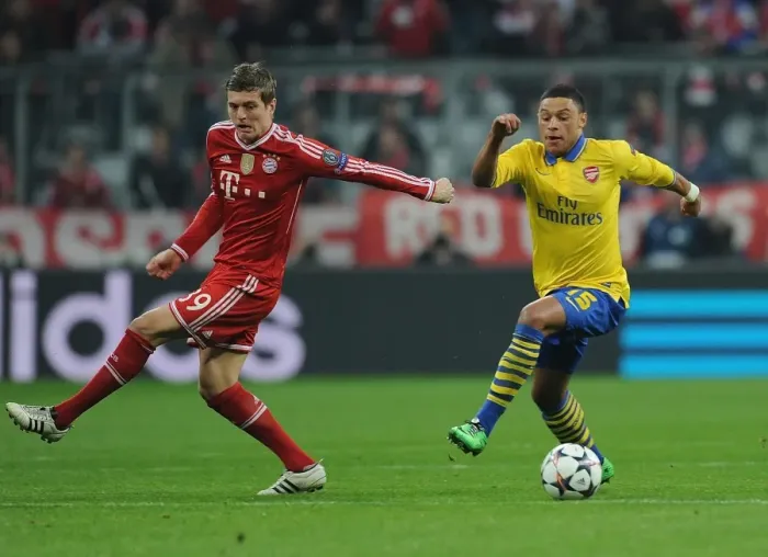 Framed Print : Alex Oxlade-Chamberlain vs Toni Kroos: Battle in the UEFA Champions League between Bayern Munich and Arsenal Framed Print : Alex Oxlade-Chamberlain vs Toni Kroos: Battle in the UEFA Champions League between Bayern Munich and Arsenal