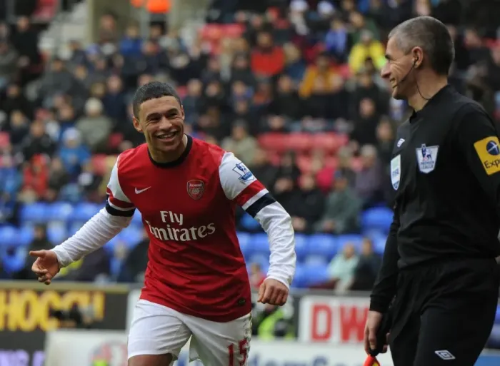 Framed Print : Alex Oxlade-Chamberlain's Light-Hearted Moment Amidst Wigan Athletic vs Arsenal Tension (2012-13) Framed Print : Alex Oxlade-Chamberlain's Light-Hearted Moment Amidst Wigan Athletic vs Arsenal Tension (2012-13)